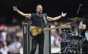 epa05564728 British musician Sting performs before the Australia Football League (AFL) Grand Final between the Sydney Swans and the Western Bulldogs at the Melbourne Cricket Ground (MCG) in Melbourne, Victoria, Australia, 01 October 2016. EPA/JULIAN SMITH AUSTRALIA AND NEW ZEALAND OUT EDITORIAL USE ONLY