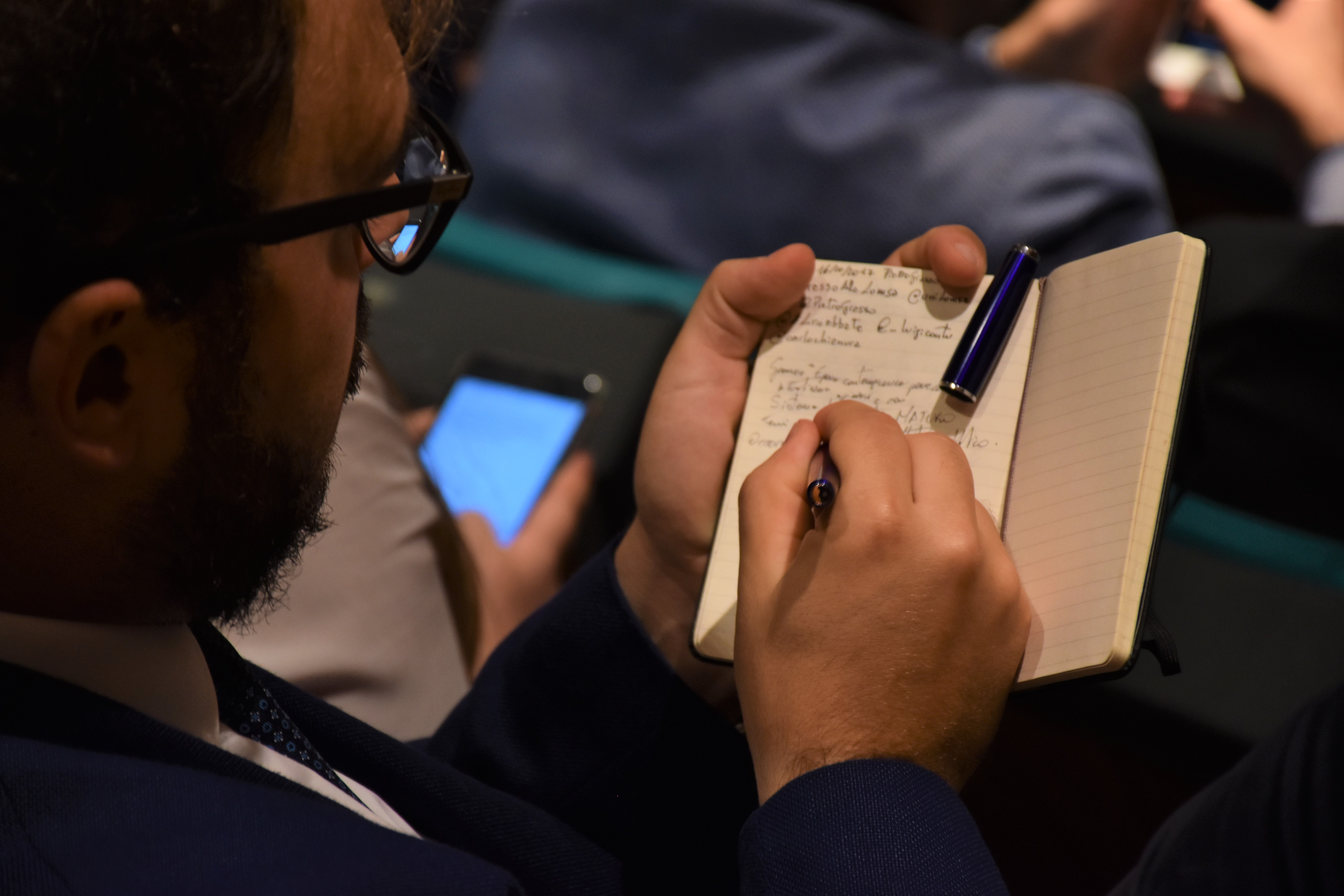 Gli studenti del Master annotano gli interventi Gli studenti del Master annotano gli interventi