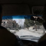 In auto verso una zona appena bombardata In auto verso una zona appena bombardata