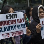 Lavoratrici protestano contro le condizioni delle donne a Hong Kong, in Cina