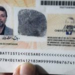 Il passaporto brasiliano dell'ex primula rossa in una foto della Polizia di Stato.