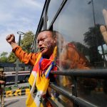 Attivista tibetano in protesta Attivista tibetano in protesta