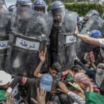 Vincitore in "Spot news", scontri tra studenti e polizia ad Algeri Vincitore in "Spot news", scontri tra studenti e polizia ad Algeri
