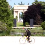 Una persona in bicicletta al parco Sempione di Milano nel primo giorno della "Fase 2" dell'emergenza del coronavirus