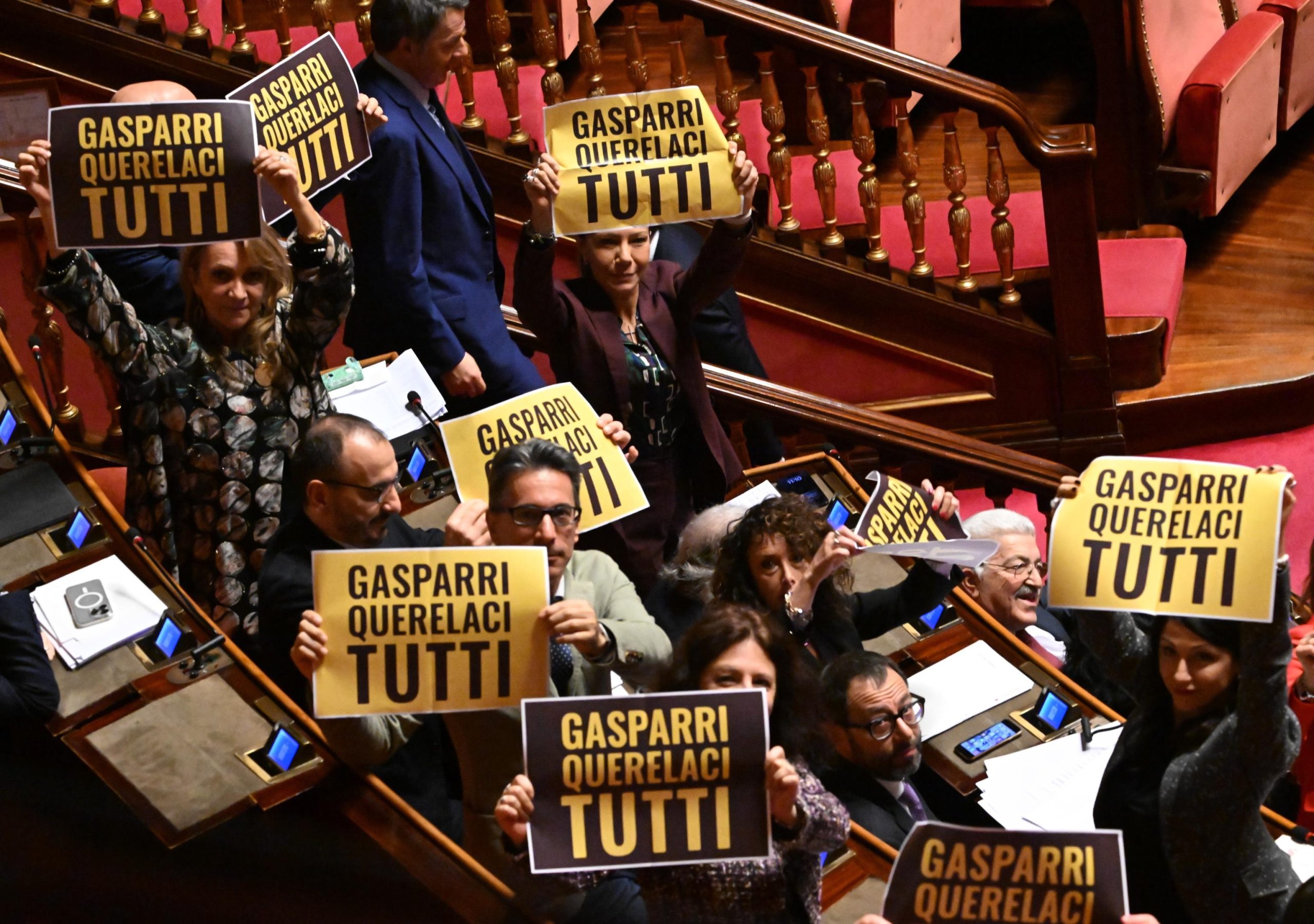 I senatori M5s sventolano cartelli in Aula al Senato con la scritta “Gasparri querelaci tutti” durante le dichiarazioni di voto sulla fiducia sulla manovra, Roma, 22 dicembre 2023