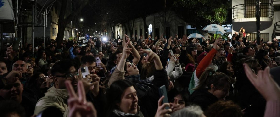Former president Cristina Fernandez celebrates the Peronist victory in recent elections from her balcony
